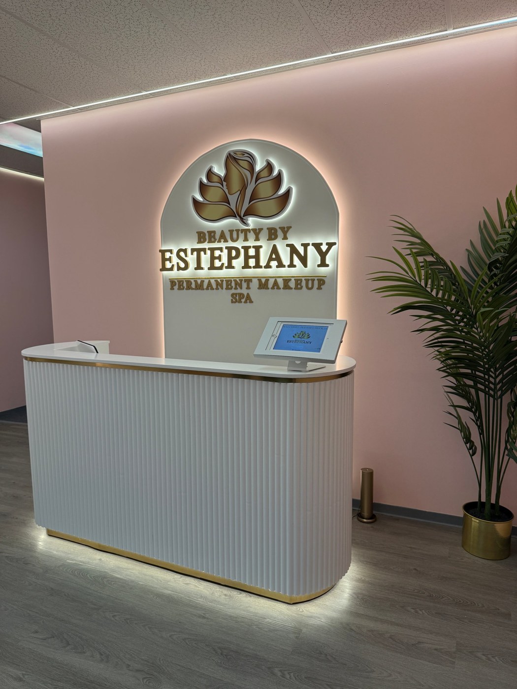 The Beauty by Estephany reception with its lit logo